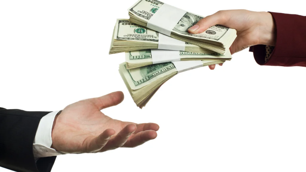 Investor analyzing falling market charts while choosing liquidity through a loan against mutual funds.